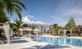 Sparkling resort style pool with private cabanas
